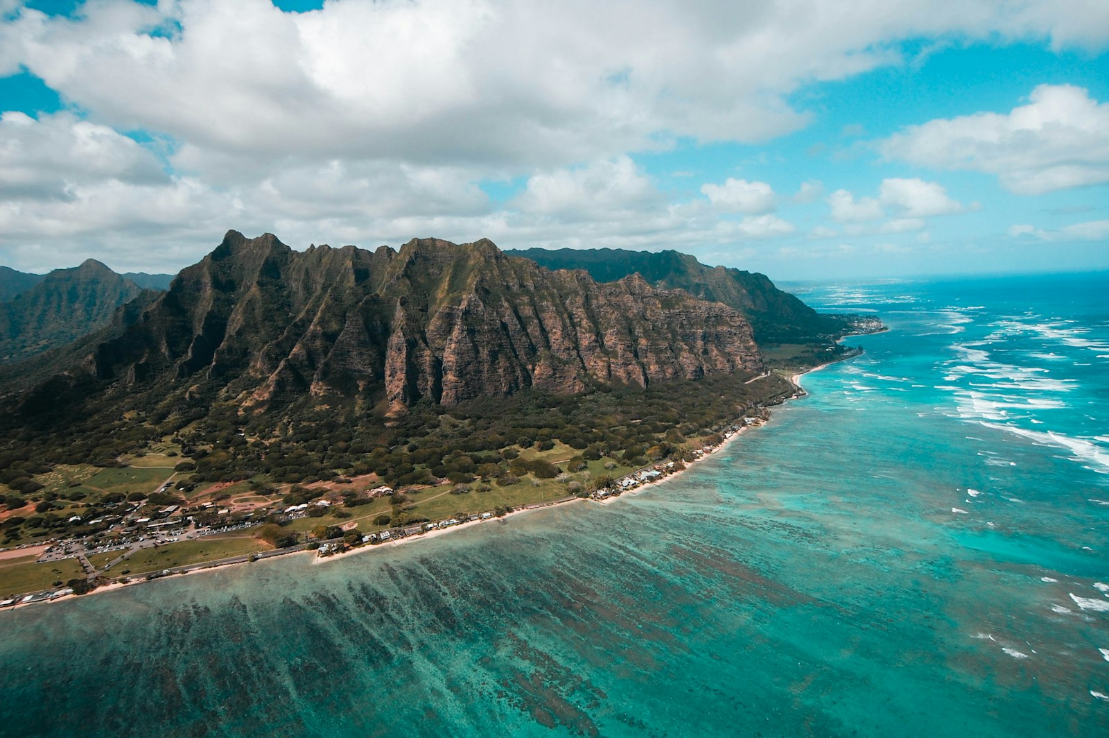 Green island ringed by turquoise sea