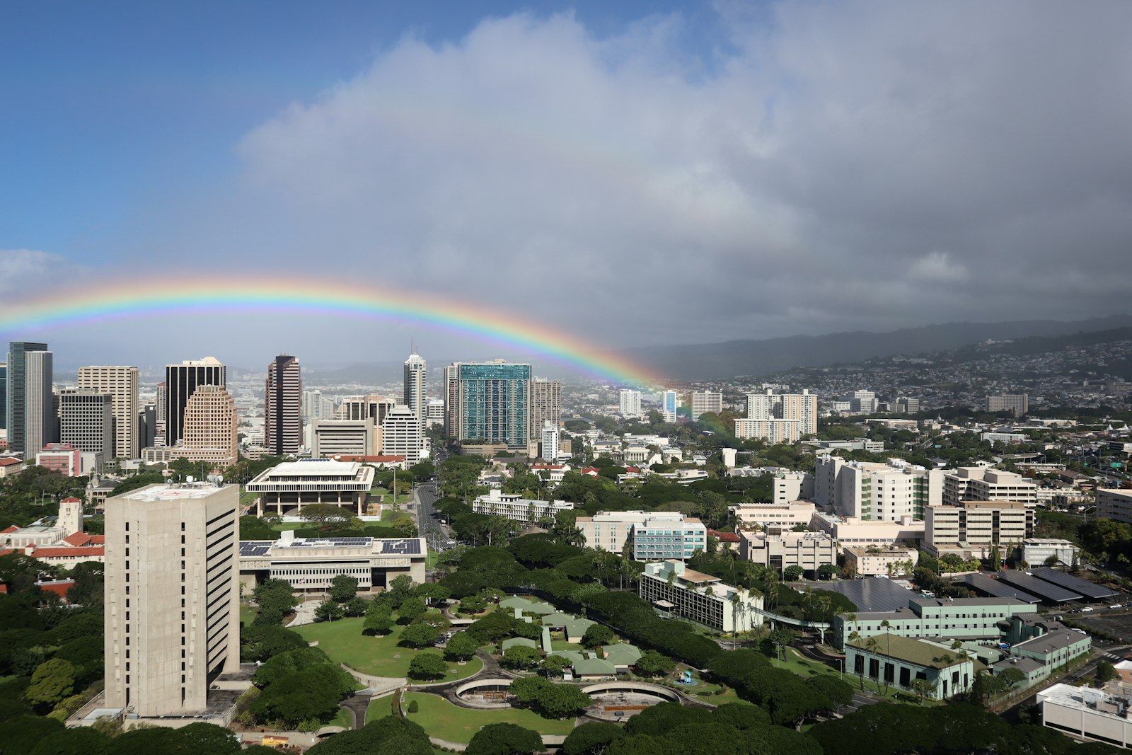 Rainbow over downtown Honolulu buildings